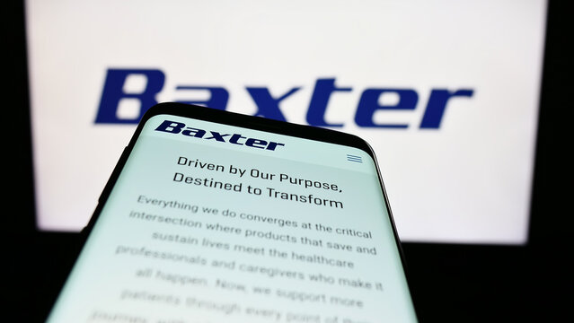 Stuttgart, Germany - 03-31-2023: Smartphone with website of American healthcare company Baxter International Inc. on screen in front of logo. Focus on top-left of phone display.