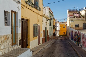View of houses down a street in the scenic city of Denia in the Valencia province of Spain
