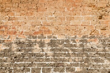 View of an old brick wall in Denia, Spain