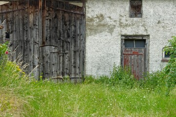 Old rural house in a rural area at the beginning of summer
