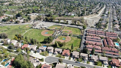 Aerial view of baseball fields in a residential neighborhood on a sunny day