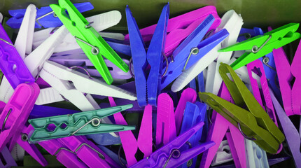 Fototapeta premium Heap of vivid blue and purple color clothespins