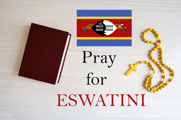 Pray for Eswatini. Rosary and Holy Bible background.