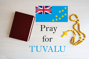 Pray for Tuvalu. Rosary and Holy Bible background.