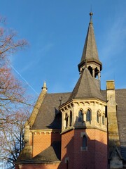 Fototapeta na wymiar German chapel roof in sunlight with blue sky