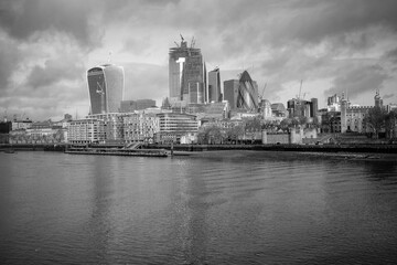 Greyscale shot of the city building in London near the harbor