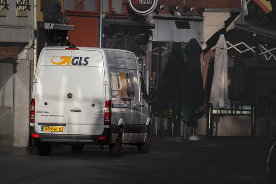 HEERLEN, NETHERLANDS - NOVEMBER 9, 2022: GLS logo on a delivery truck in Heerlen center. GLS, or General Logistics Systems, is a Dutch company providing courier, parcel, and express mail services.