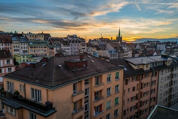 Drone shot of sunset sky over a cityscape of colorful houses