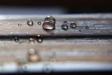 Hydrophobic surface of impregnated wood with water drops