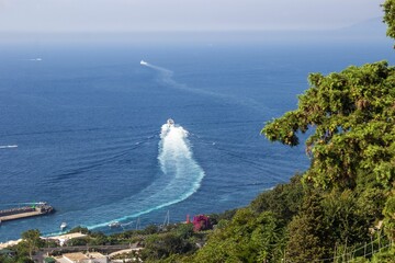 Fototapeta premium Beautiful shot of a boat in a sea near the Capri Island, Italy