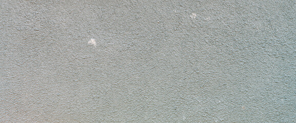 Simple texture of foundation of old building of crushed stone close-up. Minimalist urban background with gravel pattern. Full frame of wall close up. Minimal backdrop with gray foundation of house.