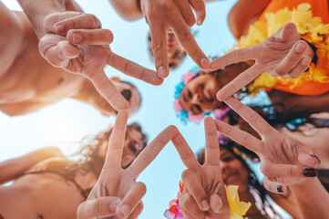Fototapeta premium Happy smiling friends together with the hands at the beach