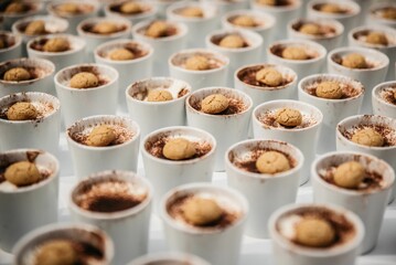 Closeup shot of the tiramisu desserts in the jars