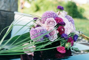 Closeup of beautiful floral decorations on a wedding limo