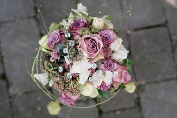 Closeup shot of the bride's bouquet with pink flowers