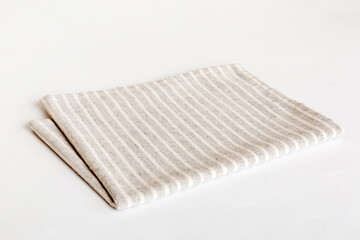 top view with gray kitchen napkin isolated on table background. Folded cloth for mockup with copy space, Flat lay. Minimal style