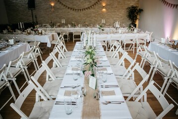 Tables in the restaurant ready for wedding party indoors