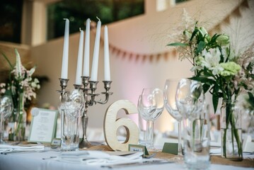 Closeup of wedding table with candles and special design