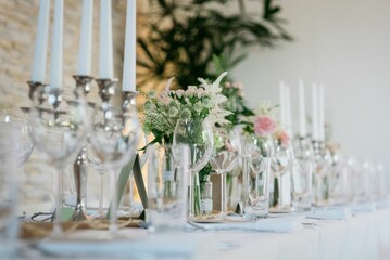 Closeup of wedding table with candles and special design