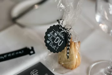 Gordijnen Black card says in English "Nice You're there" on a biscuit cover on the table with blur background © Kristina Kirsten/Wirestock Creators