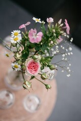 Selective focus of a decorated table with flowers in a vase ready for a wedding celebration
