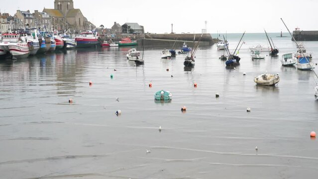 A general view of the Barfleur harbor at mid-thigh in winter. Normandy, France.