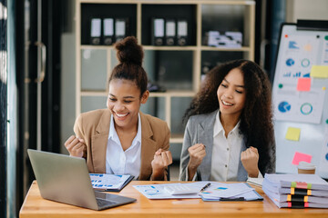 Two African business team creative businesspeople coworker, teamwork celebrating achievement and in planning design in office