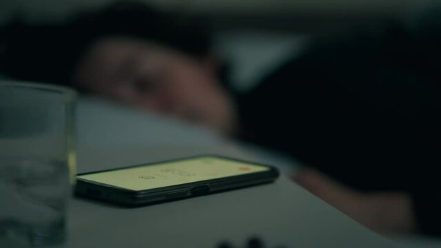 Anxiety, Middle-aged woman Not in a good mood Turns off the alarm In the apartment, In slow motion The owner of the apartment at home In deep sleep Doesn't want to be late for a new job, nightstand

