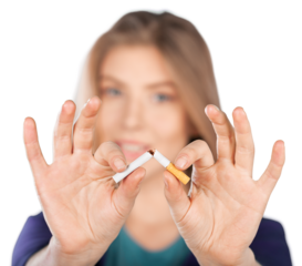 Young woman breaking cigarette  on background