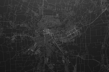 Street map of Lugansk (Ukraine) on black paper with light coming from top