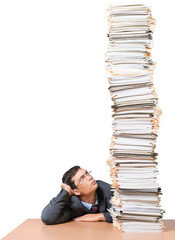 Young man looking on huge stack of papers, isolated on white background