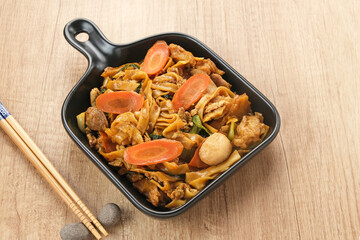 Kwetiaw or Kwetiau, fried rice noodles with meatballs and vegetables. Popular in Indonesia
