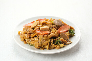 Kwetiaw or Kwetiau, fried rice noodles with meatballs and vegetables. Popular in Indonesia
