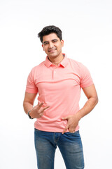 Young Indian man showing victory sign on white background