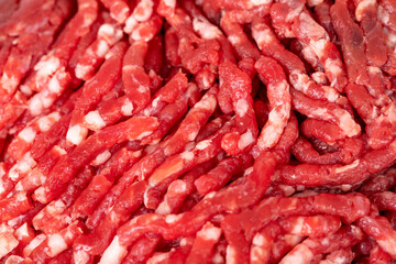 Beef minced. Fresh ground beef on wood background. Close up