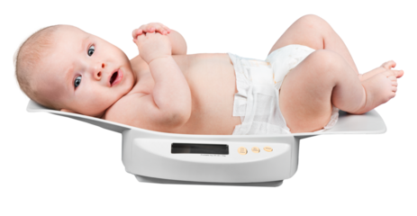Beautiful baby boy on on weighing scale