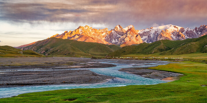 Sunset over the Central Tian Shan Mountains and glacier river, Kurumduk valley, Naryn province, Kyrgyzstan