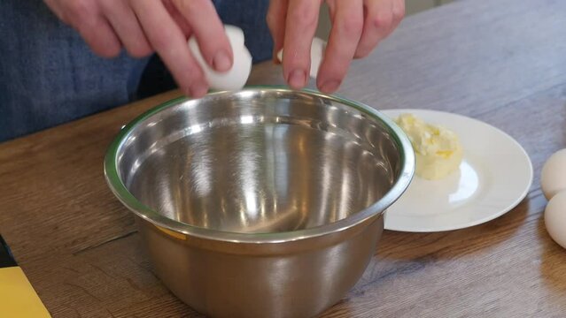 Home Cooking. Process Preparation Dough, Male Hands Cracking Eggs
