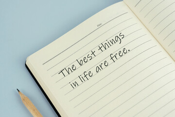 Inspirational quotes written on note pad - The best things in life are free
