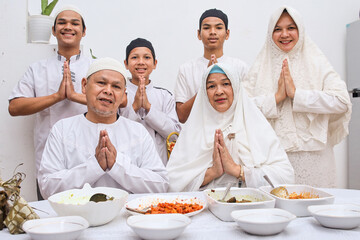 Potrait of family muslim greeting eid mubarak  
