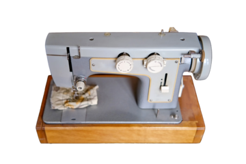 Electric sewing machine produced in the Soviet Union (USSR), isolated on a white background