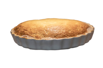 A large pie in a baking dish is in the oven