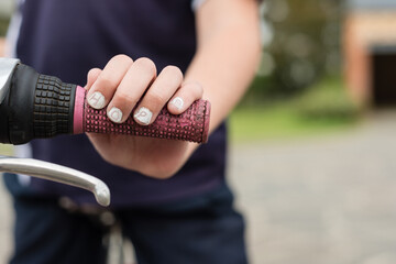 child's hand with "hope" written on the nails