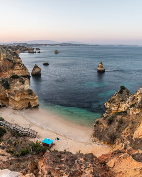 View of Praia do Camilo during sunset, Algarve region, Portugal.