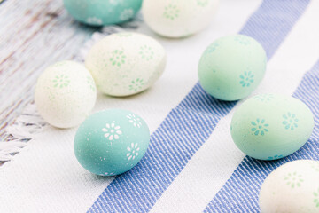 Holiday, Easter decoration, painted eggs on wooden table, closeup