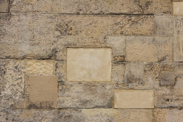 Texture of old yellow and gray stone wall for background. Old town style