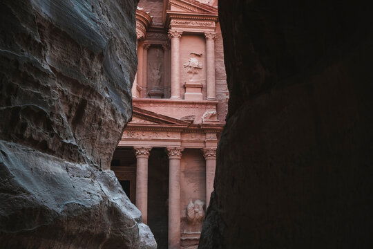 Petra Treasury (El Khazneh) partially hidden, reveals itself at the end of the Siq canyon, Petra, UNESCO World Heritage Site, Jordan, Middle East