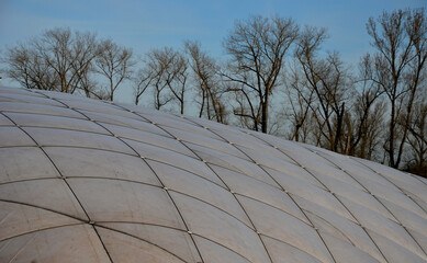 inflatable playing arena, tennis head made of white rubber textile. in a regular grid it is...