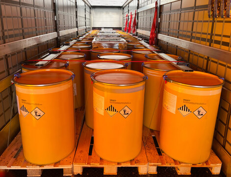 Loading, Transportation And Unloading Of Barrels With Hazard Class 9 In A Semi-trailer. Transportation Of Dangerous Goods By ADR Cargo Transport