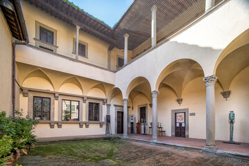 Fototapeta na wymiar House museum of Italian poet and man of letters Francesco Petrarca in Arezzo, Italy, the exterior facade with Renaissance cloister with classical arches and columns, Arezzo , Italy, February 12, 2020